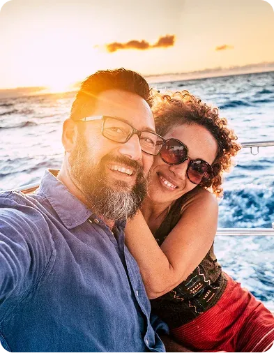 A happy couple enjoying a sunset boat outing